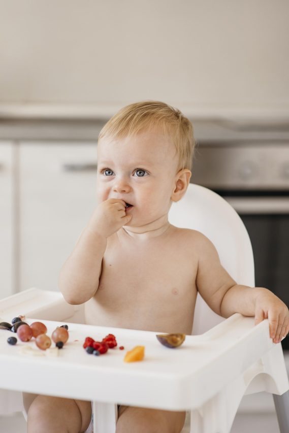 cute baby eating alone scaled e1737487729138